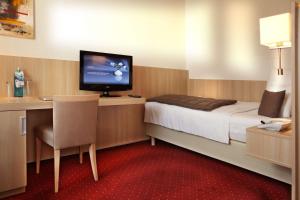 Katil atau katil-katil dalam bilik di Best Western Hotel zur Post