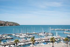 a marina filled with lots of boats in the water at Hotel Grand Koper in Koper