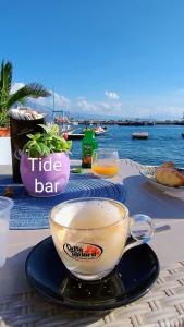 a table with a cup of coffee on top of it at The Sorabellas in Gaeta