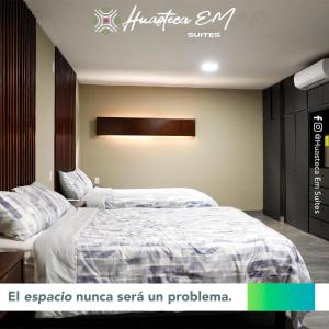 Llit o llits en una habitació de Huasteca Em suites