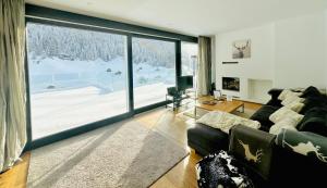 Uma área de estar em Schooren des Alpes Luxury Apartments