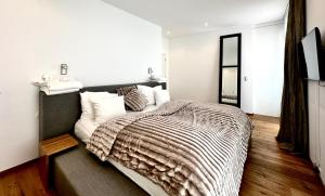 Cama ou camas em um quarto em Schooren des Alpes Luxury Apartments