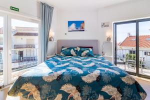 Voodi või voodid majutusasutuse Nazare Oasis Suites toas