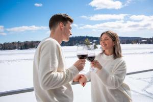 a man and a woman holding glasses of wine at Estérel Resort in Esterel