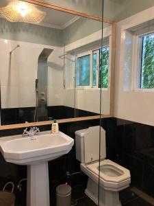 a bathroom with a sink and a toilet at MAR VERDE - Parede-Cascais in Parede