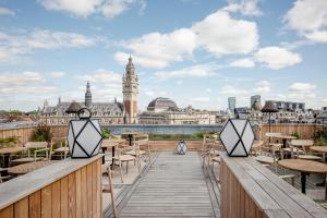 a view of the city from the roof of a building at Grand Hotel Bellevue - Grand Place in Lille