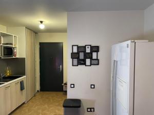 A kitchen or kitchenette at Appartement Résidence Neuve