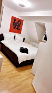 Una cama o camas en una habitación de Ferienwohnung in der Altstadt,3