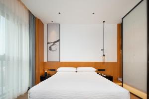 Cama ou camas em um quarto em Fairfield by Marriott Zhuhai Xiangzhou