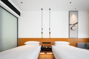 Cama ou camas em um quarto em Fairfield by Marriott Zhuhai Xiangzhou