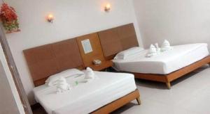 เตียงในห้องที่ Asia Novo Boutique Hotel-Dumaguete