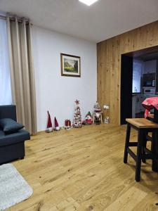 a living room with wooden floors and a christmas tree at Natalia in Leoben