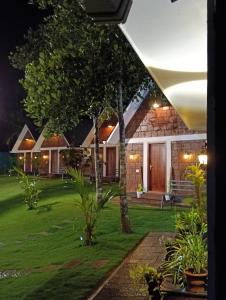 a view of a house at night at Wild Part in Sultan Bathery