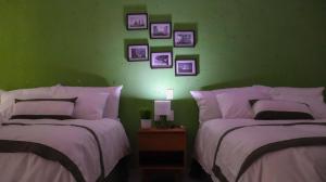 Giường trong phòng chung tại XAIL Hotel