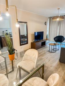 Uma TV ou centro de entretenimento em Maison Verte - Premium Apart