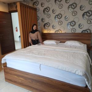 Ліжко або ліжка в номері SENAYAN SUITES