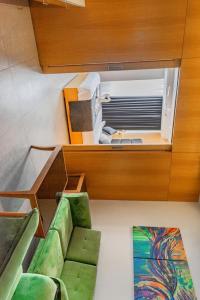 an overhead view of a room with chairs and a window at HOTEL Tamarind in Mohali