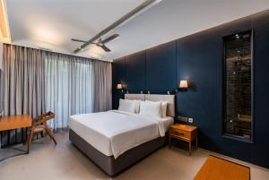 A bed or beds in a room at Radisson Resort and Spa Lonavala