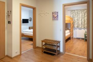 Кровать или кровати в номере Praga Apartments & Restaurant Zell am See-Kaprun