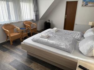 Cama ou camas em um quarto em Hotel Nordseegruß