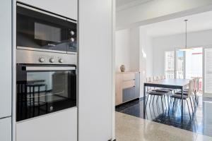 A cozinha ou cozinha compacta de Hauzify I Apartament Riera