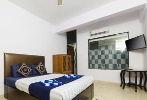 Krevet ili kreveti u jedinici u okviru objekta Homes Stay In Candolim GOA