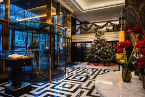 a christmas tree in the lobby of a hotel at Hilton Vienna Plaza in Vienna