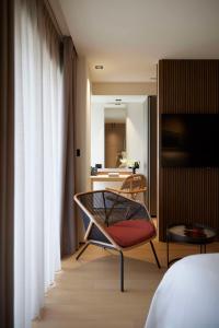 Tempat tidur dalam kamar di Dusit Suites Athens