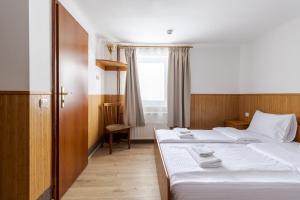 Posteľ alebo postele v izbe v ubytovaní Robert Hotel