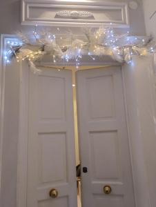 a door with a string of lights above it at BARI 102 in Bari