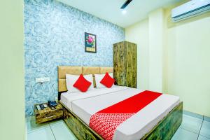 Hotel O Grace Villa में एक कमरे में एक या कई बेड