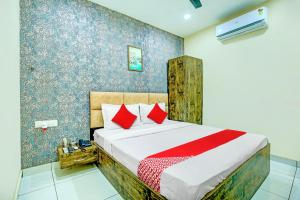 Hotel O Grace Villa में एक कमरे में एक या कई बेड