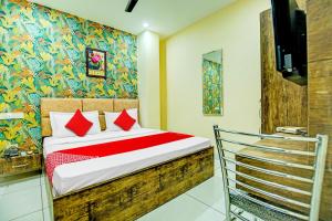 Hotel O Grace Villa में एक कमरे में एक या कई बेड