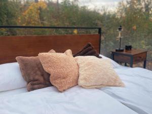 a bed with two pillows on top of it at Hotel Harzresidenz in Thale