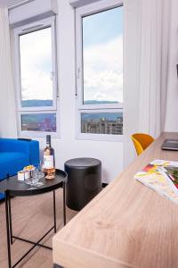 Khu vực ghế ngồi tại Apparthotel Le Hüb Grenoble