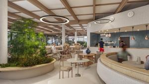 een weergave van een restaurant met tafels en stoelen bij The Editory by the Sea Lagos in Lagos