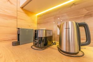 อุปกรณ์ชงชาและกาแฟของ Poiana Ski Residence Apartment 5