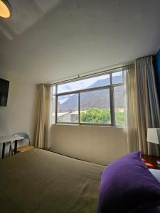 A bed or beds in a room at Hotel Acuario