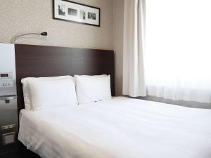 Llit o llits en una habitació de Comfort Hotel Tokyo Higashi Nihombashi