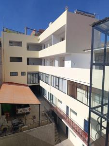 an external view of a building with a balcony at casa SKALA in Puno