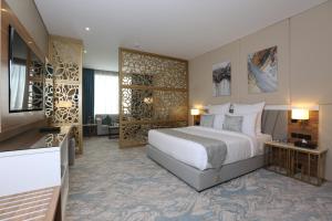 Cama ou camas em um quarto em Cantonal Hotel by Warwick