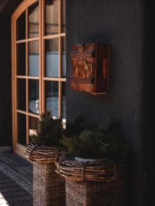 a room with two baskets and a window at Sportony Mountain Lodges in La Villa