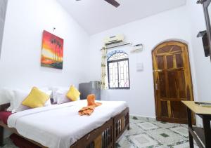 מיטה או מיטות בחדר ב-Ocean View Cottage Goa