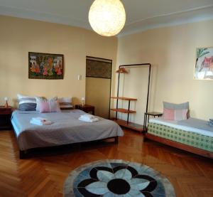 a bedroom with two beds and a rug at arte vida boutique guesthouse in Salzburg