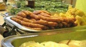 a tray of sausages and other food on a buffet at Albert Hotel in Akita