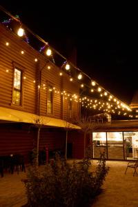 a building with christmas lights on the side of it at Waterloo Village in Pidhorodne