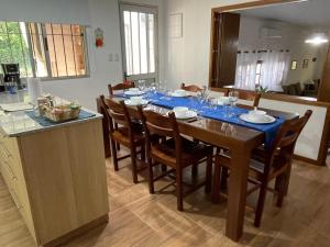 a dining room table with a blue table cloth on it at Magnolio in Colonia del Sacramento