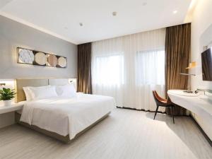 Posteľ alebo postele v izbe v ubytovaní Ibis Styles Chengdu Chunxi Taikoo Li Hotel