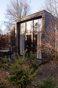 Um jardim em Tiny House Mayu - Veluwe Airco 4 persons