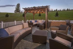 a patio with couches and a gazebo at Fairfield Inn & Suites by Marriott Altoona in Altoona